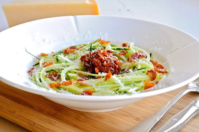 Zucchini Spaghetti with Tomato-Almond Pesto, Pancetta & Parmesan
