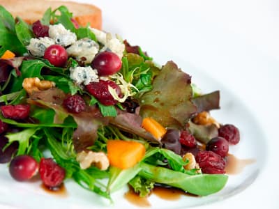 	 Green Salad with Pomegranate Vinaigrette and Goat Cheese Garnish