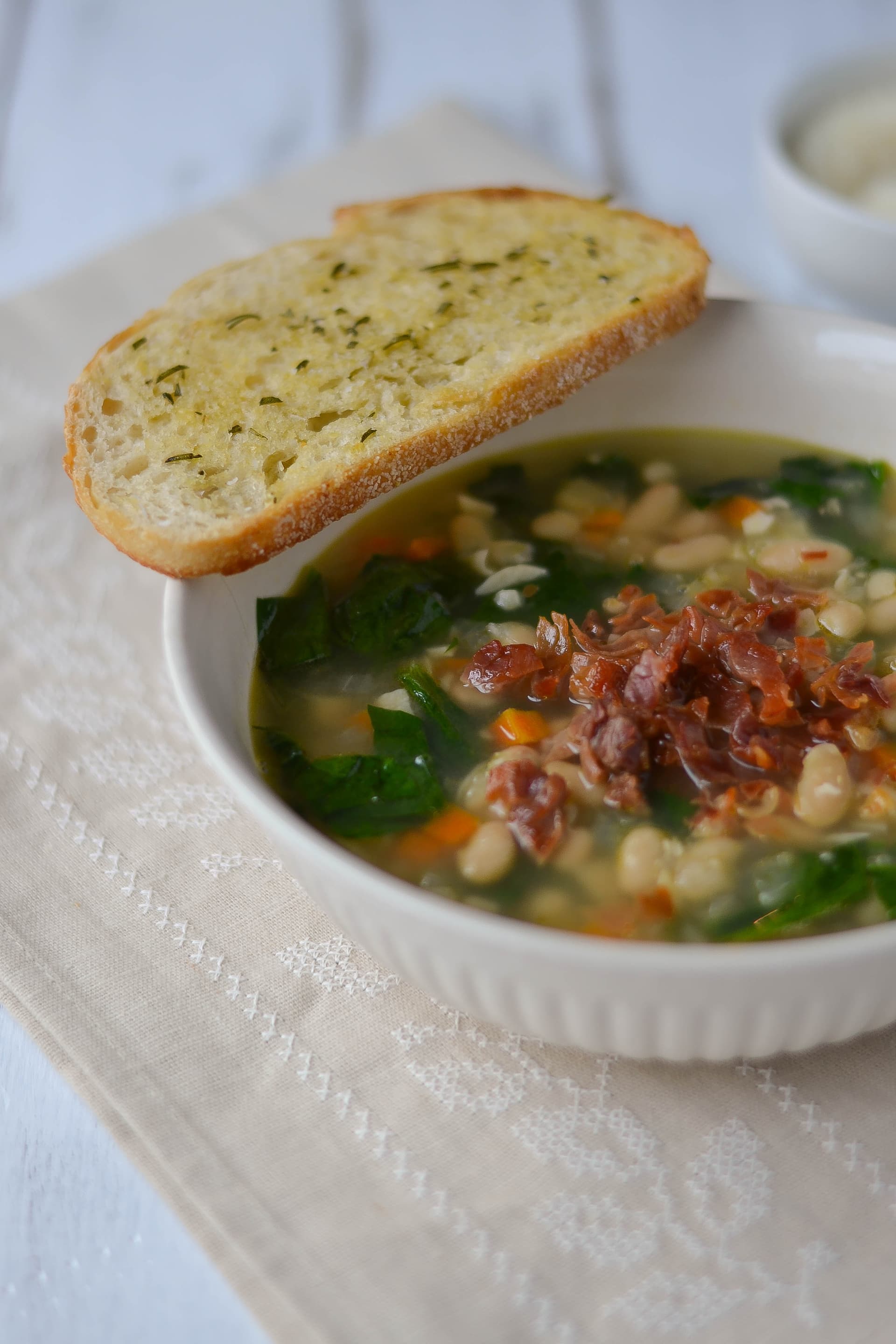White Bean and Garlic Soup with Spinach and Crispy Prosciutto and Rosemary-Garlic Toasts