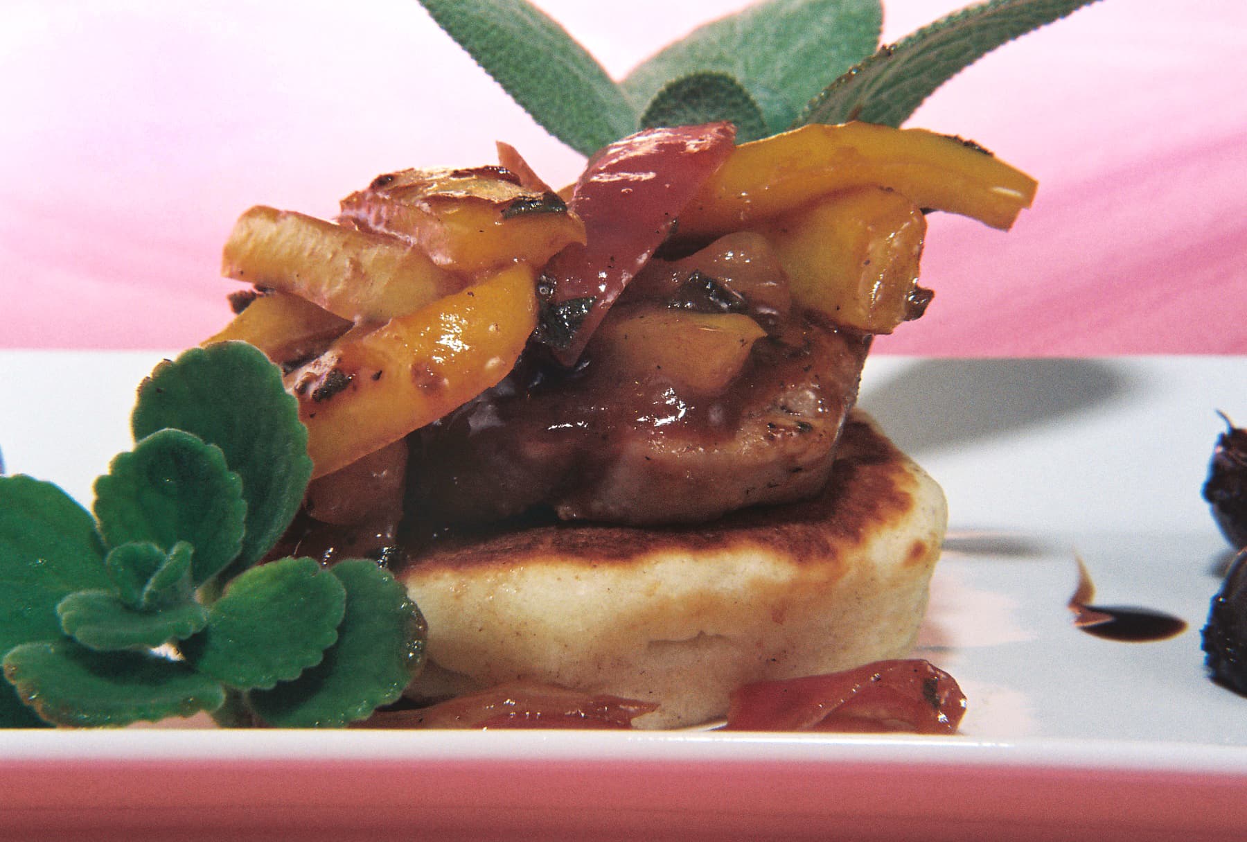 Brandy Plum Pork Tenderloin Served On Buttermilk Corn Cakes