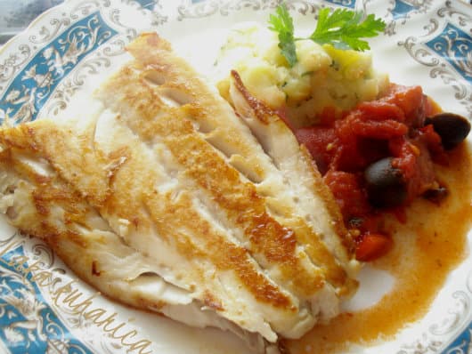 Cod with tomatoes, olives and chorizo