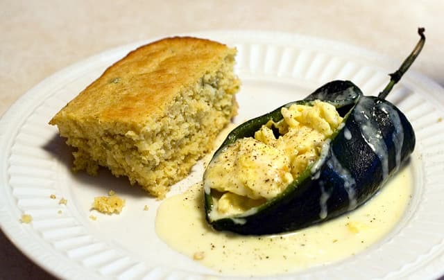 Scrambled Egg-Stuffed Poblano Chiles With Spicy Cheese Sauce