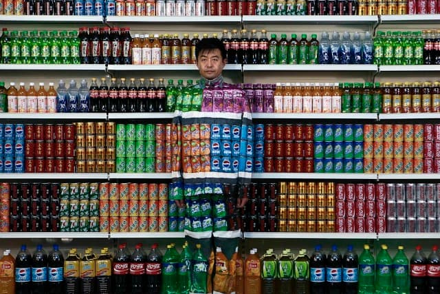 Chinese Artist Blends into Grocery Store Shelf for ‘Plasticizer'