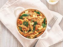 Mustard Seed Tomato Curry Fusilli with Leafy Greens and Queso Fresco