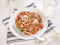 Spaghettini with Fresh Clams, Sausage, Cherry Tomatoes, Edamame, Chili and Flat Leaf Parsley