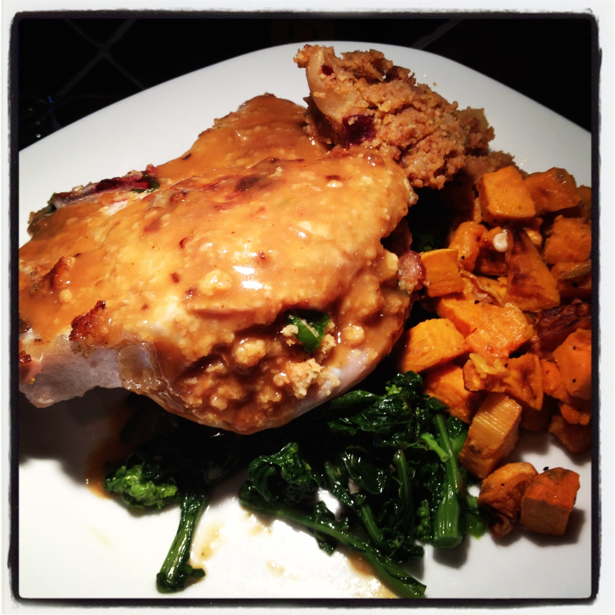 Cornbread Stuffed Pork Chop with Roasted Sweet Potatoes & Broccoli Rabe