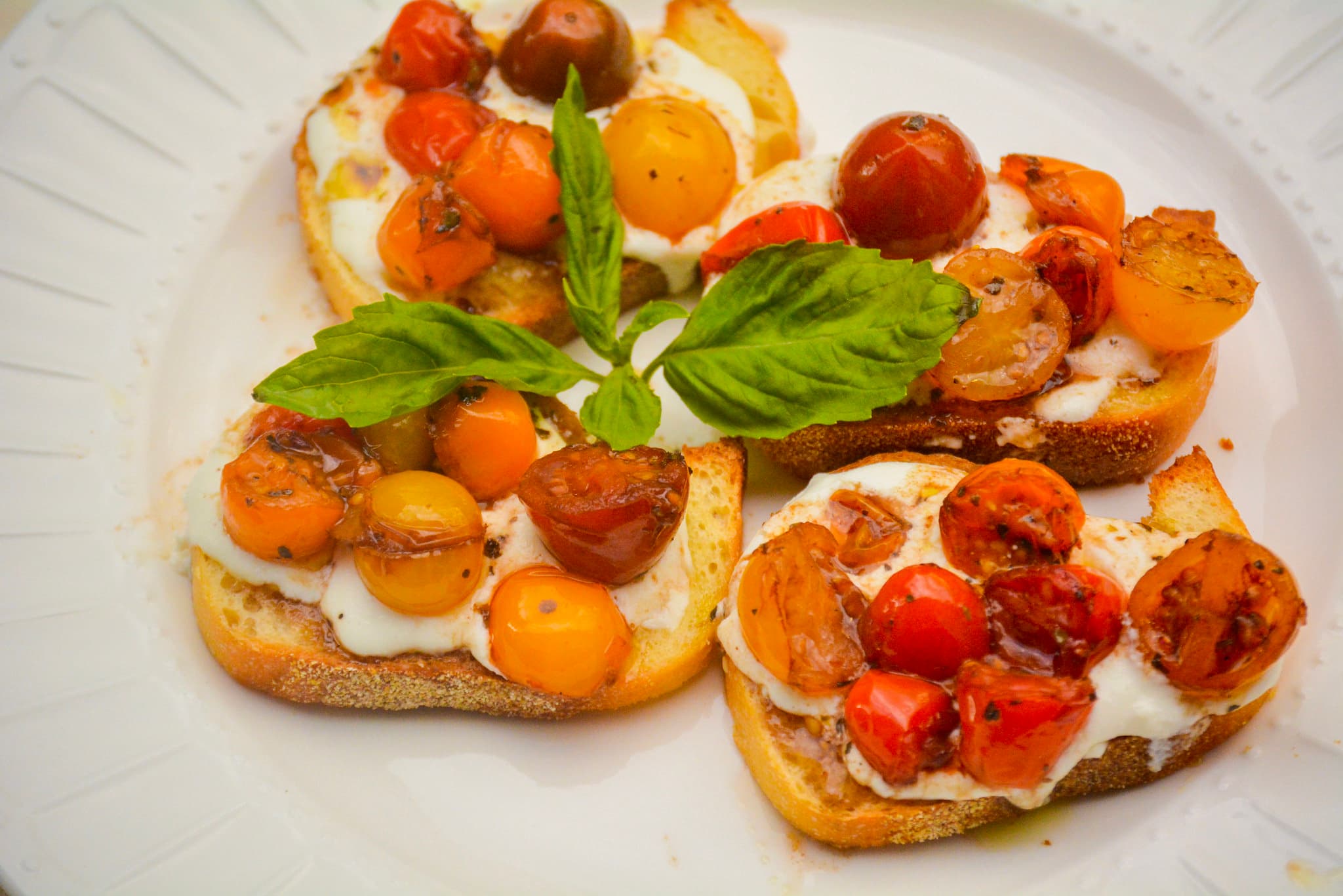 Warmed Red Wine Tomatoes and Ricotta Crostini 