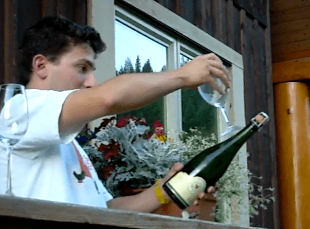 Man Opens Champagne Bottle Using Wine Glass