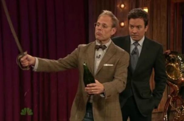 Alton Brown sabres a champagne bottle