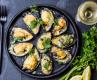 Baked mussels with parmesan cheese, white wine and herbs